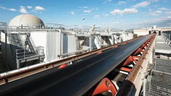 An automated smart conveyor delivers feedstock from the organics recovery facility to fill “hoppers” that feed the digesters.